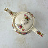 Overhead view of vintage Sadler teapot showing floral decoration across the lid, body, spout, and handle.