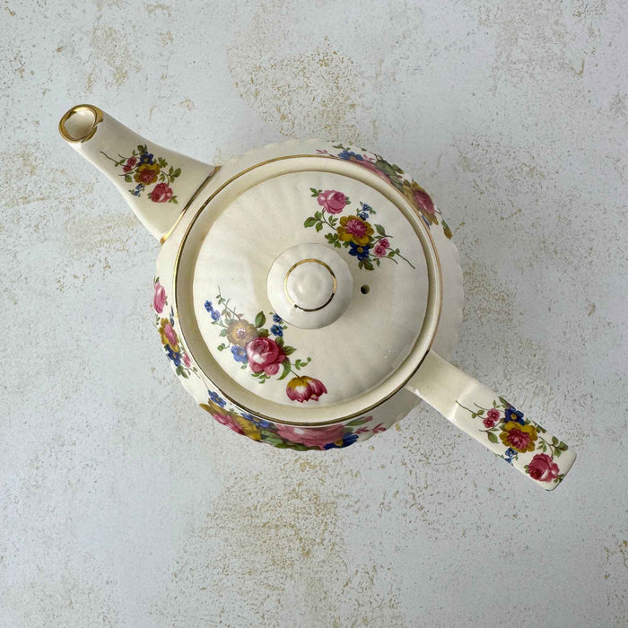 Overhead view of vintage Sadler teapot showing floral decoration across the lid, body, spout, and handle.