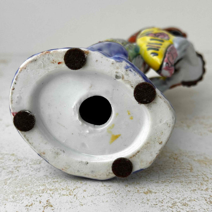 Unglazed base of vintage Chinese porcelain woman figurine with felt pads and central drainage hole; no maker's mark visible