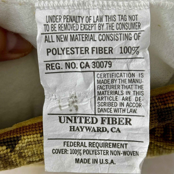 Original pillow insert label identifying 100% polyester fiber fill and Made in U.S.A.