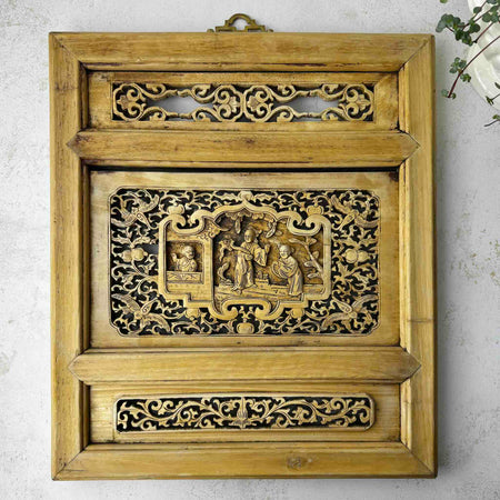 Vintage Chinese carved wood wall panel with openwork lattice surround and central relief scholar scene, brass hanger at top, warm golden tan wood tone