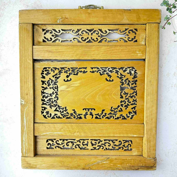 Back of vintage Chinese carved wood wall panel showing openwork carving in reverse and visible wood grain
