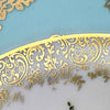 Close-up of the gray and gold inner border, including a small original gold curl extending onto the turquoise rim.