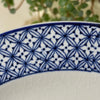 Close-up of blue geometric border pattern and visible crazing on a Wood & Sons Yuan plate.
