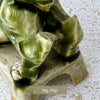 Close-up of the second foo dog showing a chip to the rear leg area and age-related wear