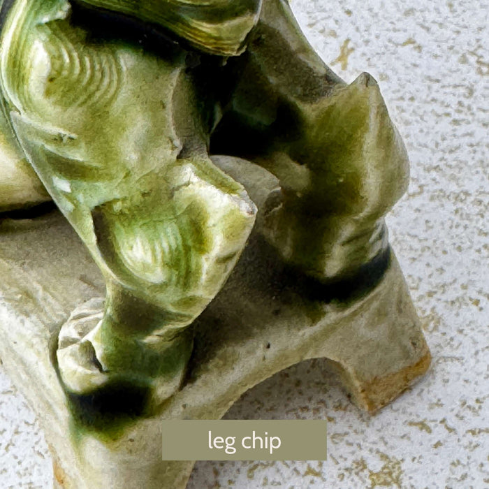 Close-up of the second foo dog showing a chip to the rear leg area and age-related wear