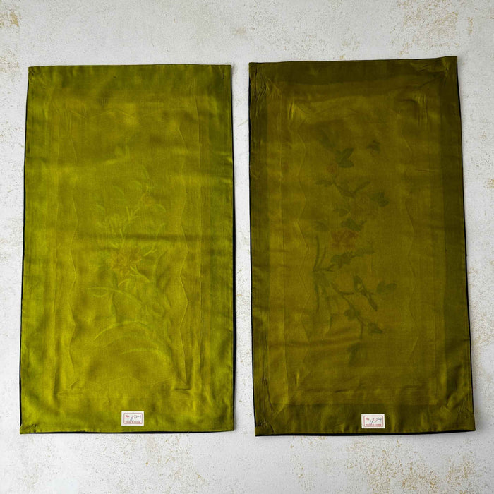 Back view of pair of vintage Chinese embroidered textile panels with olive green fabric backing