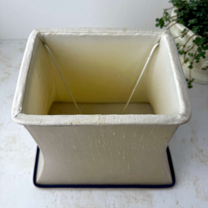 Top view of the original cream lamp shade showing the interior structure and age-related wear