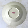 Underside of a vintage Syracuse China bowl showing the Federal Shape Syracuse China Made in America backstamp.