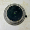 Bottom view of unmarked vintage blackened brass pitcher showing circular base and dark finish.