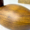 Close-up of the duck’s rounded wooden body showing the warm brown stain, natural grain, and smooth satin finish.