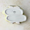 Underside of the porcelain duck pair showing two recessed base areas, an impressed designer signature and model number, and the printed Rosenthal Germany backstamp.