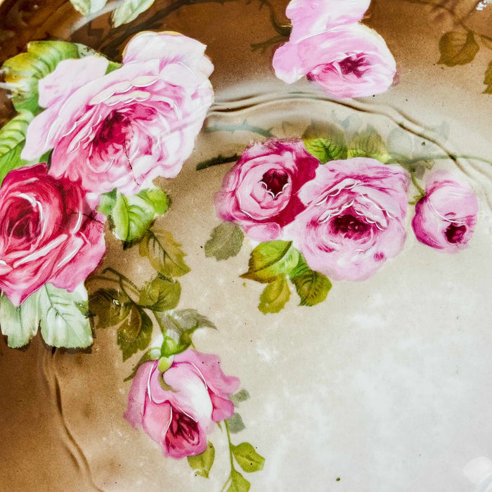 Close-up of pink roses on large antique Carl Tielsch pink rose bowl 