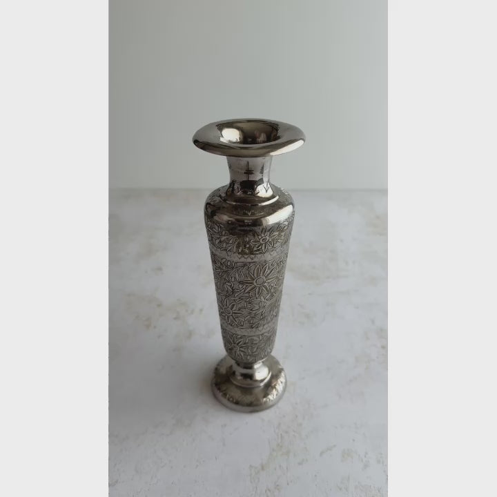Short video of engraved bud vase turned to show underside of base, into neck, and rotated to show all sides
