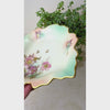 Video of vintage Schumann Arzberg porcelain trinket dish showing mauve florals, aqua shading, scalloped leaf form, and gold details.