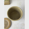 Vintage stoneware crock with the matching lid alongside, showing the crock interior and then panning to the crock front