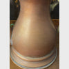 Vintage copper kettle in a styled setting, shown from the front, spout side, overhead, and handle side.