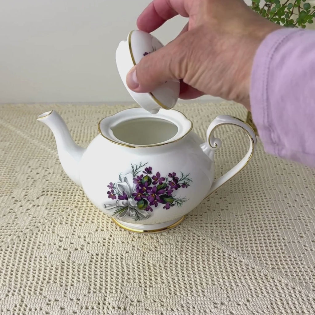 Vintage Royal Grafton teapot demonstrated by locking the lid in place and lifting the teapot into a pouring position