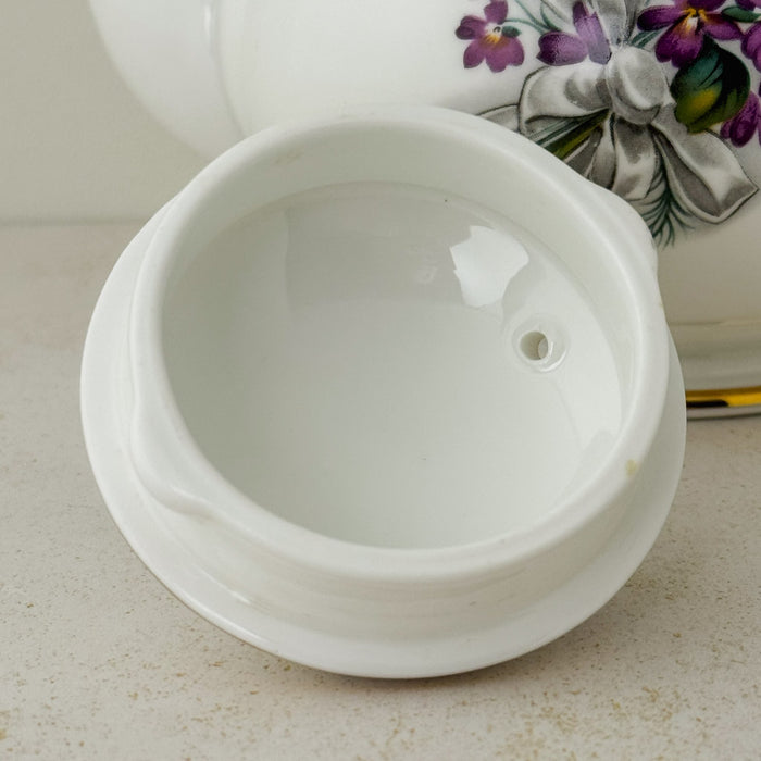 Close-up of underside of lid of Royal Grafton purple violets teapot